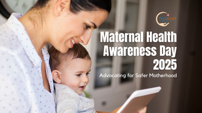 A smiling mother holding her baby while looking at a tablet, symbolizing the importance of maternal health and technology in advocating for safer motherhood. The image features the text 'Maternal Health Awareness Day 2025: Advocating for Safer Motherhood' along with the FeldCare Connects logo.