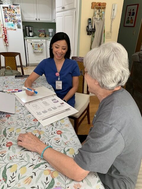 Cecilia Smith working with a patient during a home visit