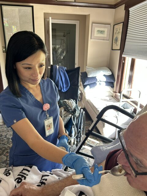 Cecilia supporting a patient during swallowing therapy